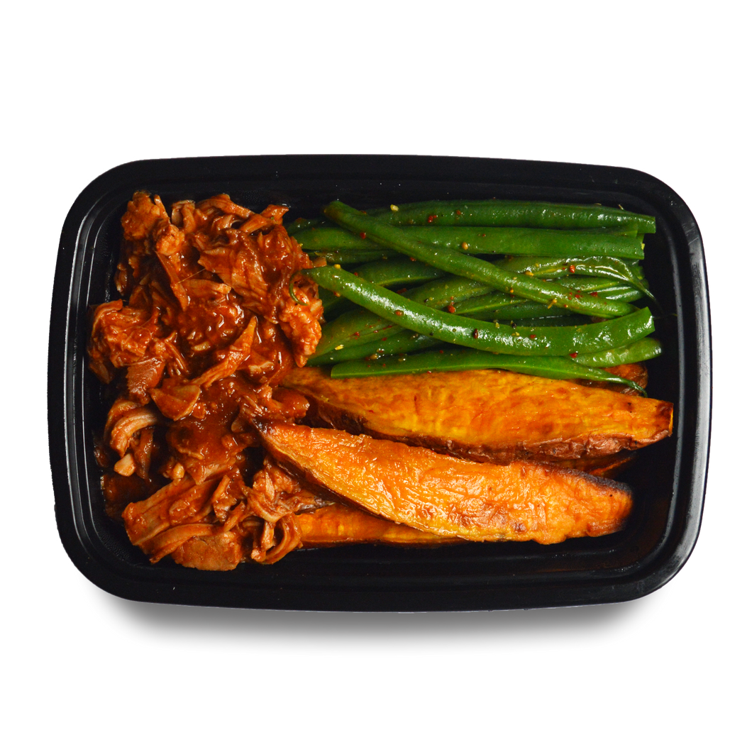 Slow-cooked pulled pork in a housemade Bourbon BBQ sauce, with roasted sweet potato wedges and chili-spiced green beans