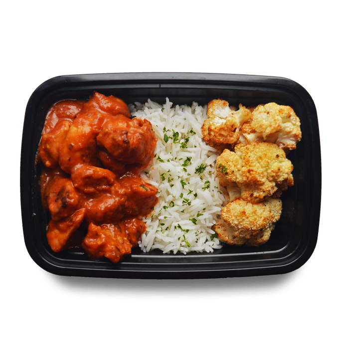 Chicken pieces in a butter chicken sauce, steam basmati rice, roasted cauliflower